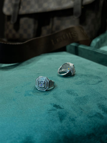 Royal Emerald-Cut Statement Ring on green velvet