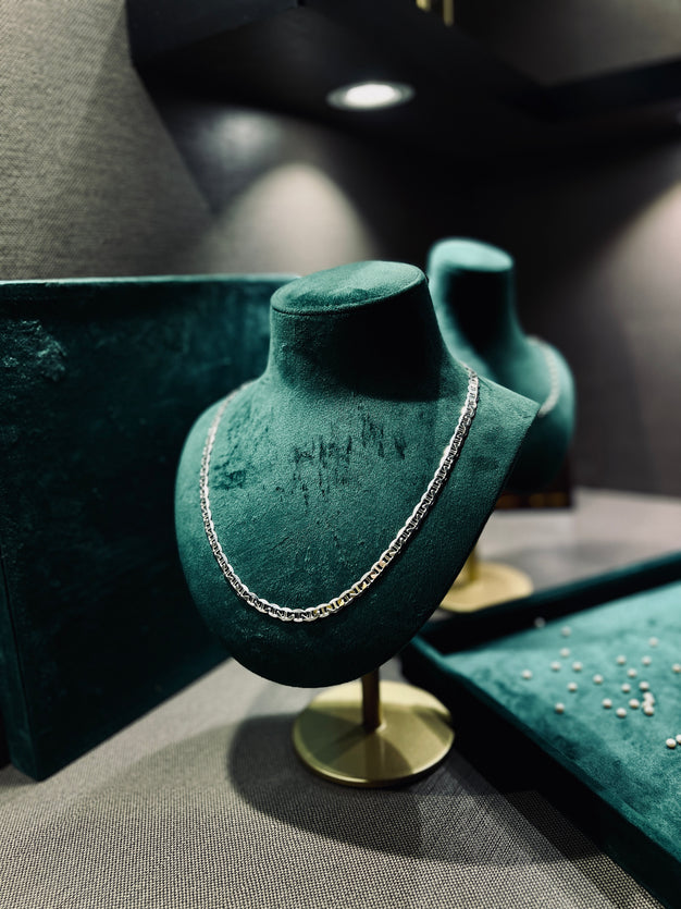 Imperial Link Chain displayed on green velvet